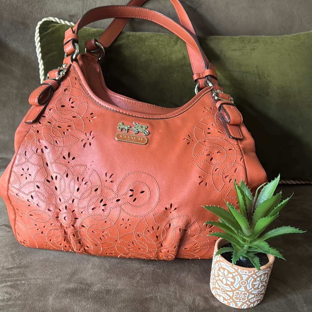 Coach Orange Leather Shoulder Bag with Cutout Floral Design